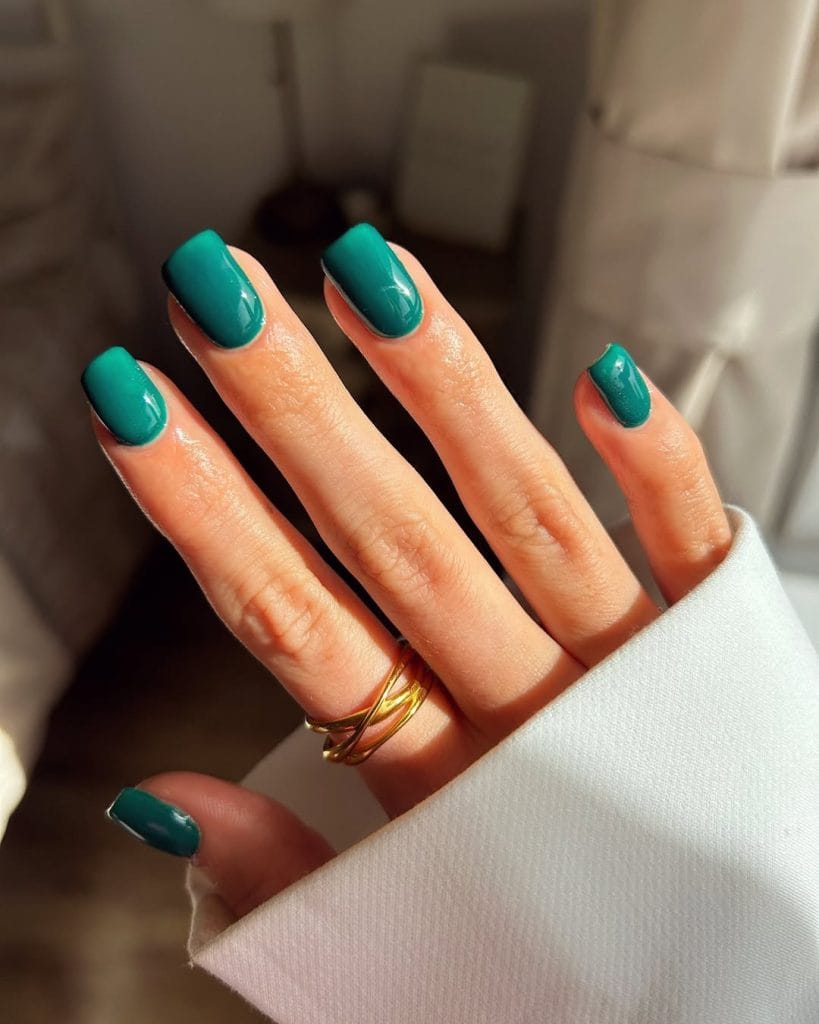Square September nails with emerald green shimmer polish