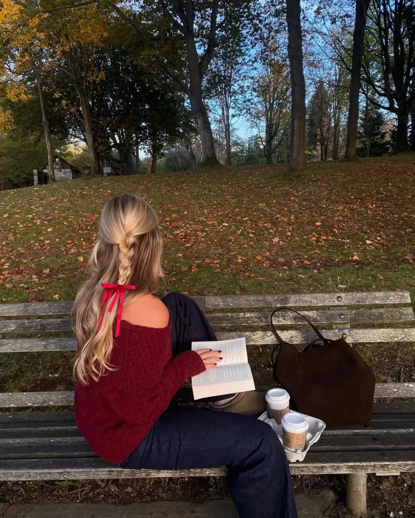 all outfit with burgundy off-shoulder sweater, navy wide-leg pants and red ribbon hair accessory