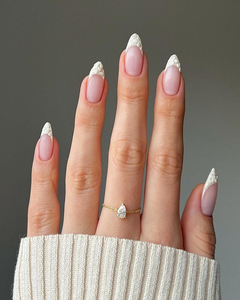 White textured fall French tip nails with patterned tips on almond shaped nails