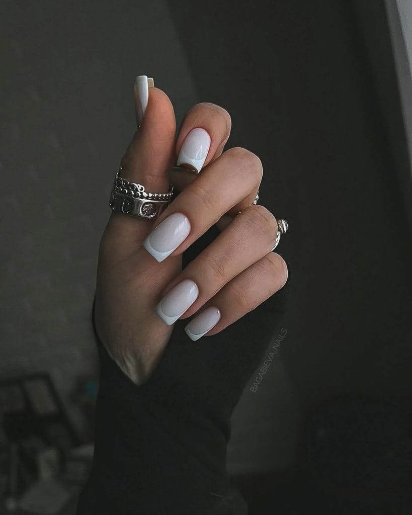 Long square white old money fall nails with French tips and silver rings