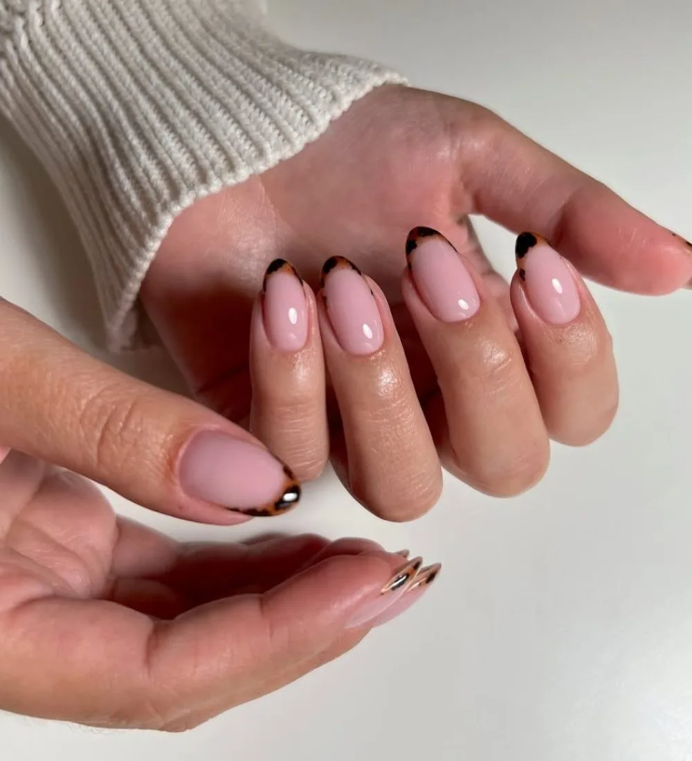 Tortoiseshell fall French tip nails with shell pattern tips on pink base