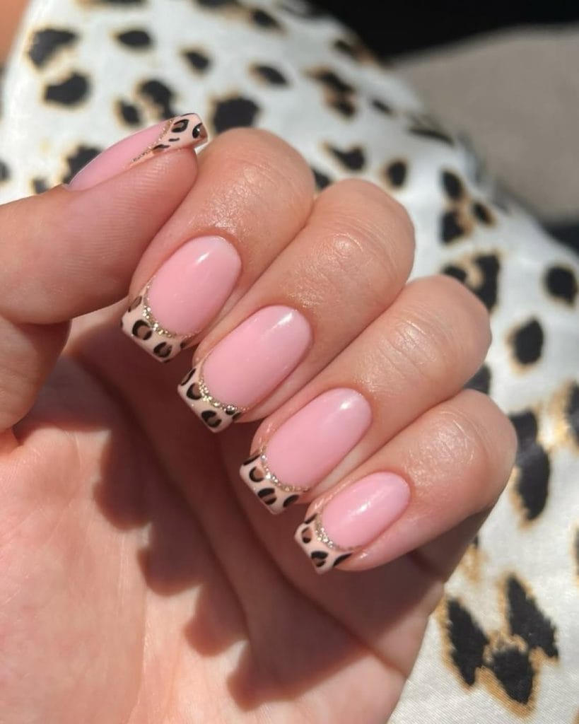 Leopard print fall French tip nails with animal print tips on pink base