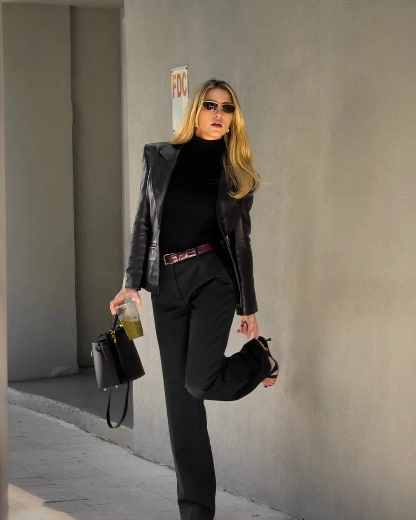 Sophisticated old money outfit with black leather blazer, turtleneck, wide-leg trousers and burgundy belt