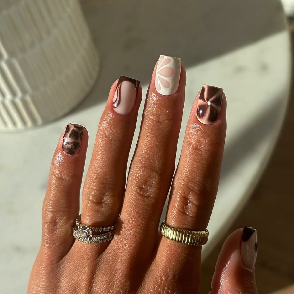 Mixed September nail art with florals, swirls, and French tips