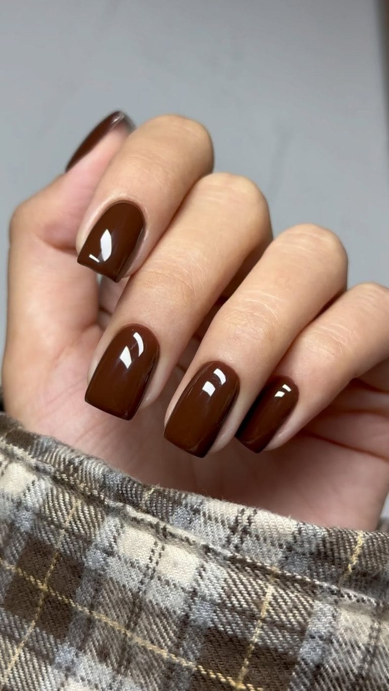 Short fall nails in chocolate brown with high gloss finish and square shape