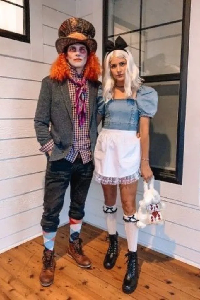 couple dressed as Alice in Wonderland and the Mad Hatter for Halloween