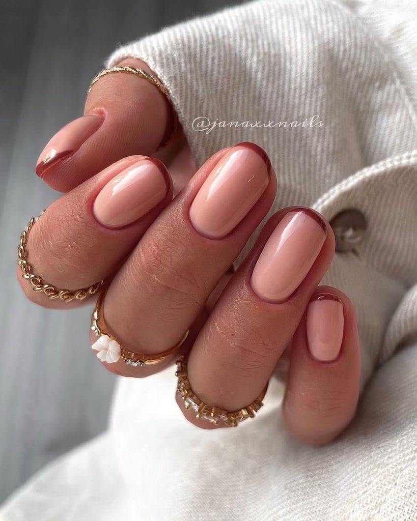 Burgundy French tip nails on short round nails
