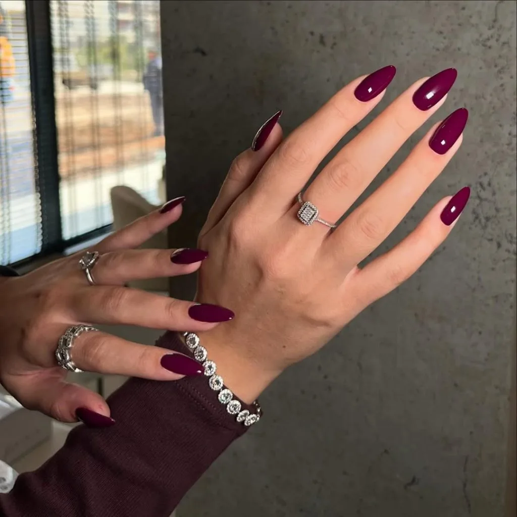 Long almond old money fall nails in deep plum purple with diamond jewelry