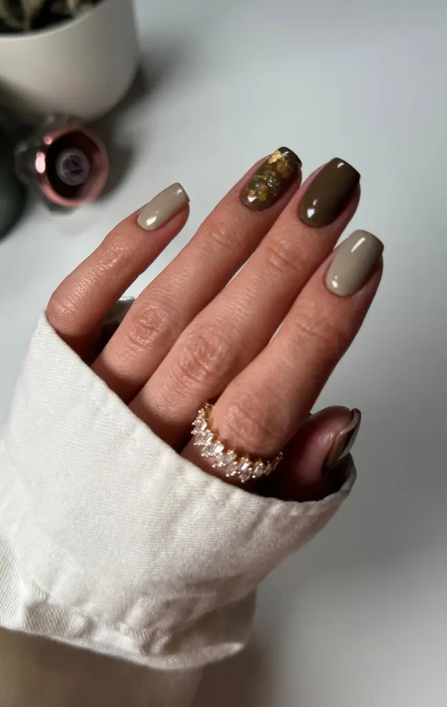 Short fall nails in taupe and olive green with gold foil accent nail in glossy finish