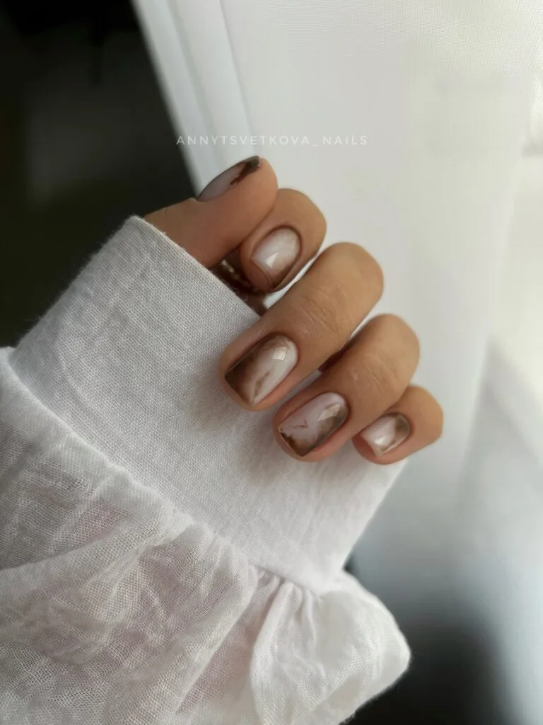Short square fall nails with milky bases and smoky brown marble edges
