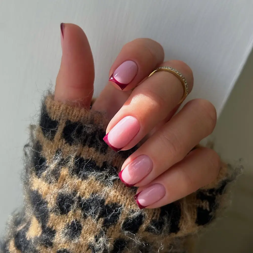 Short fall nail designs with pink base and cherry red French tips in glossy finish