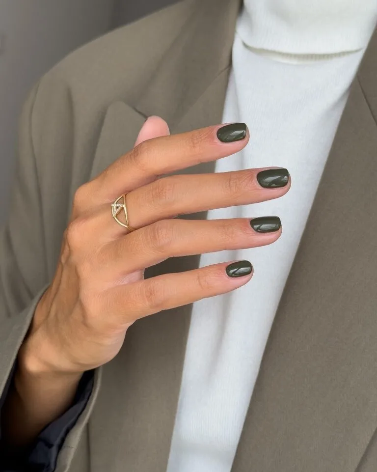 Short, softly squared old money fall nails in glossy dark olive green.