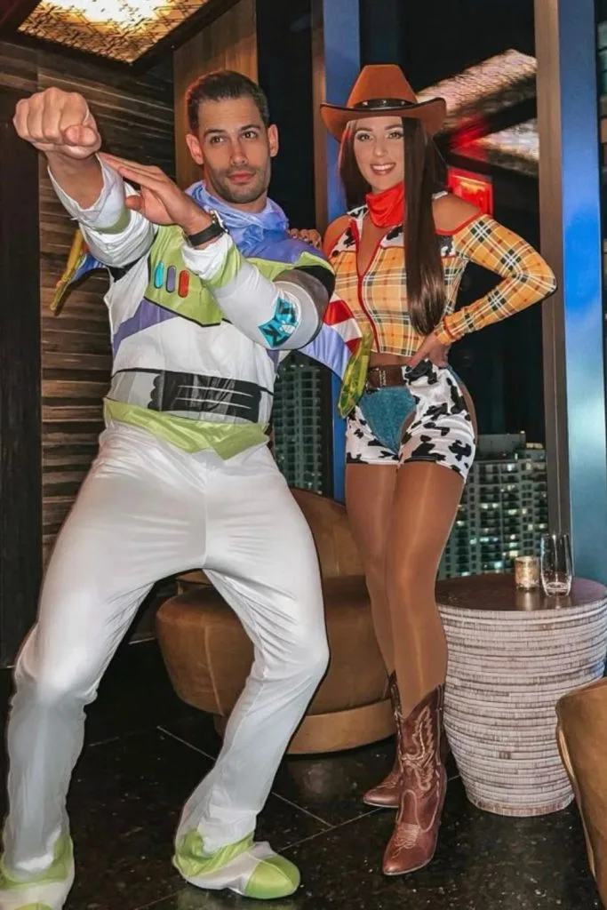 couple dressed as Buzz Lightyear and Jessie Toy Story costumes