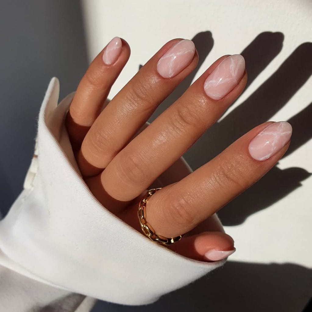 Short nude September nails with marble design