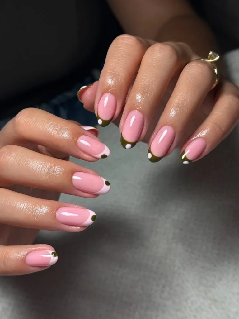 Simple fall nails with soft pink bases, olive and white French accents, and small dot details.