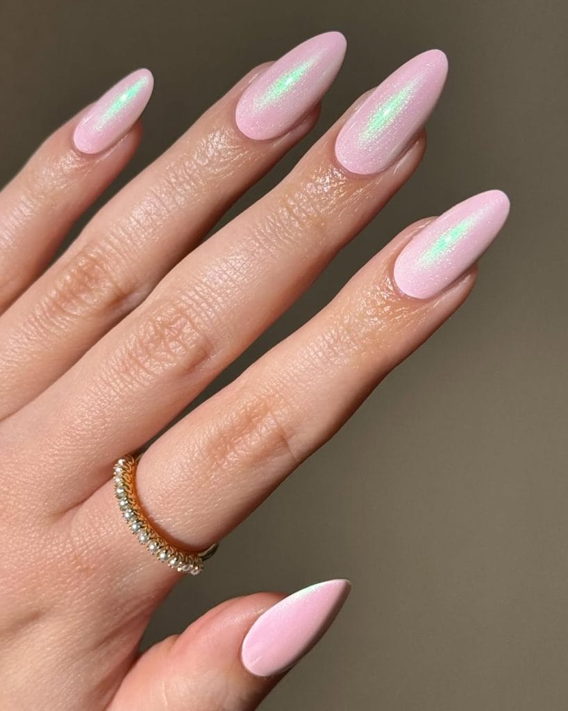 Long almond summer nails with soft pink base and chrome shimmer stripe accent