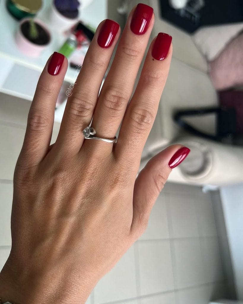 Short square September nails with classic red polish