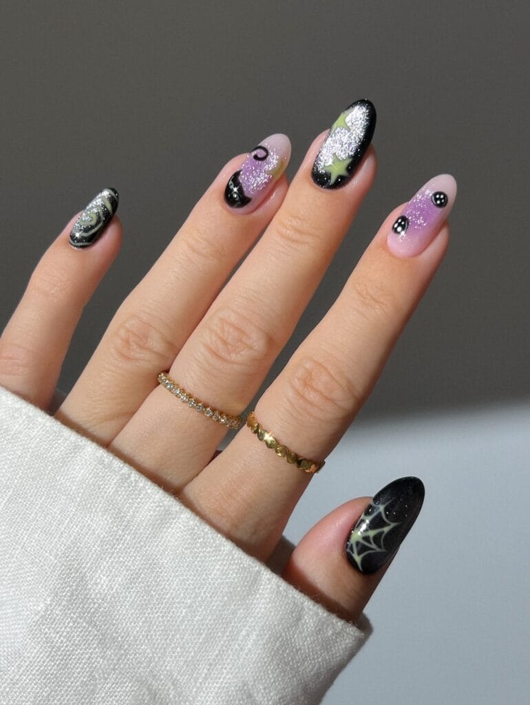  black and lilac glitter almond nails with glow green spiderweb and stars, Halloween nail idea
