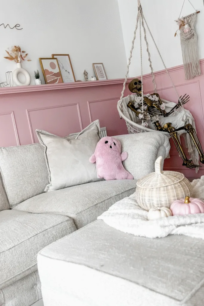 Skeleton Halloween decor in hanging chair with pink room