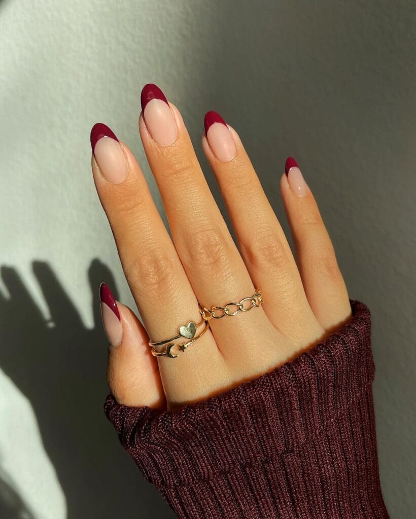 almond nails with nude base and burgundy French tips, Halloween nail design