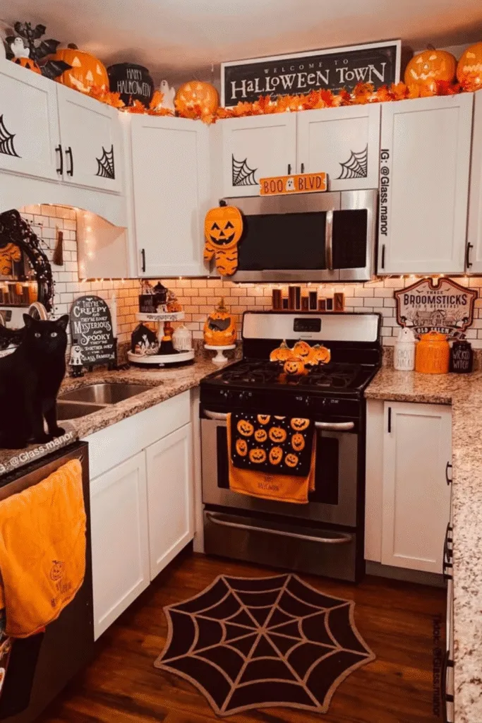 Halloween decor ideas in kitchen with pumpkins, signs and spider webs