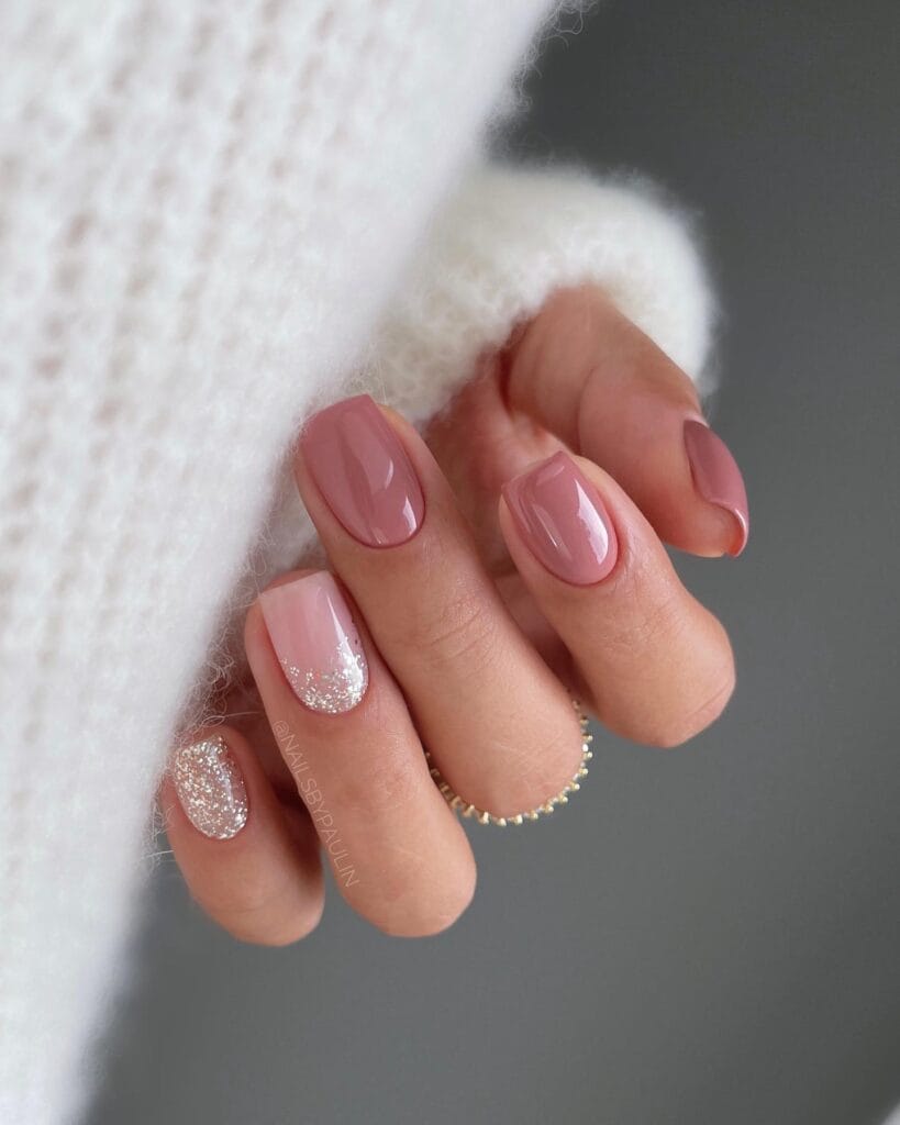 short nails with blush polish and silver glitter accents, October nail ideas