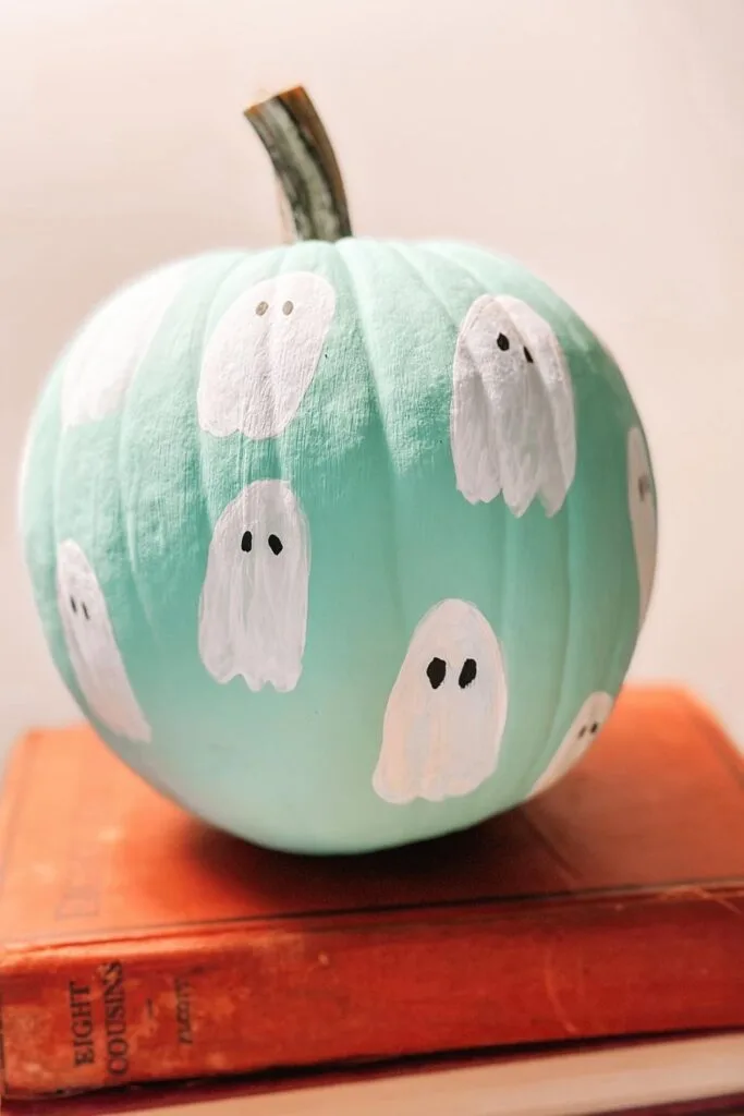 Mint green painted pumpkin with white ghosts