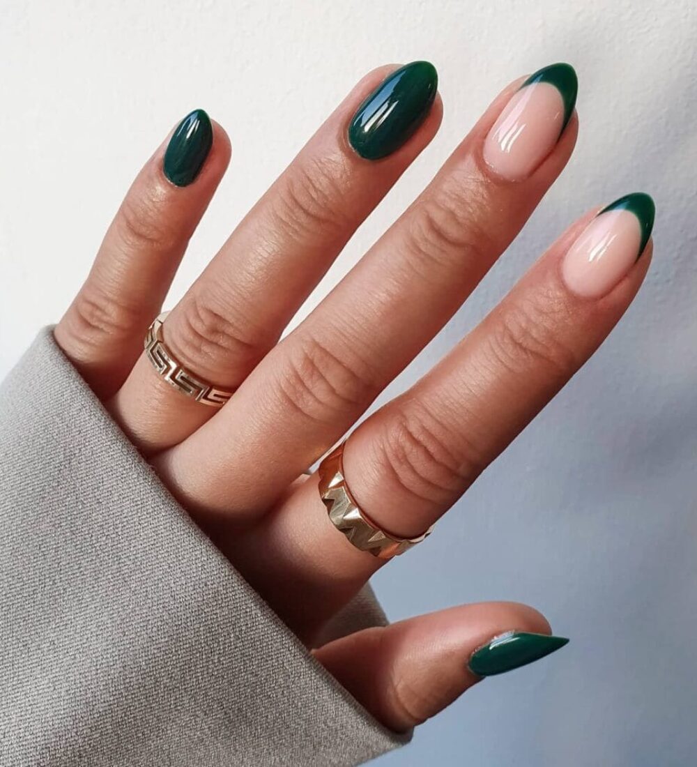 Almond dark green nails with mix of solid polish and French tips