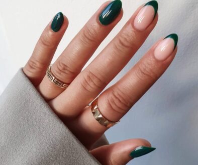 Almond dark green nails with mix of solid polish and French tips