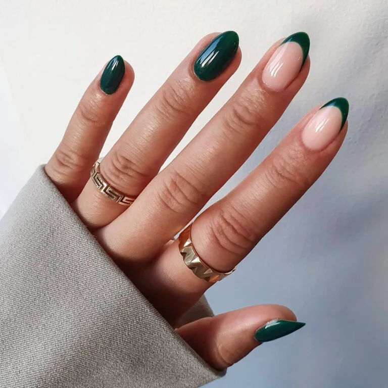 Almond dark green nails with mix of solid polish and French tips