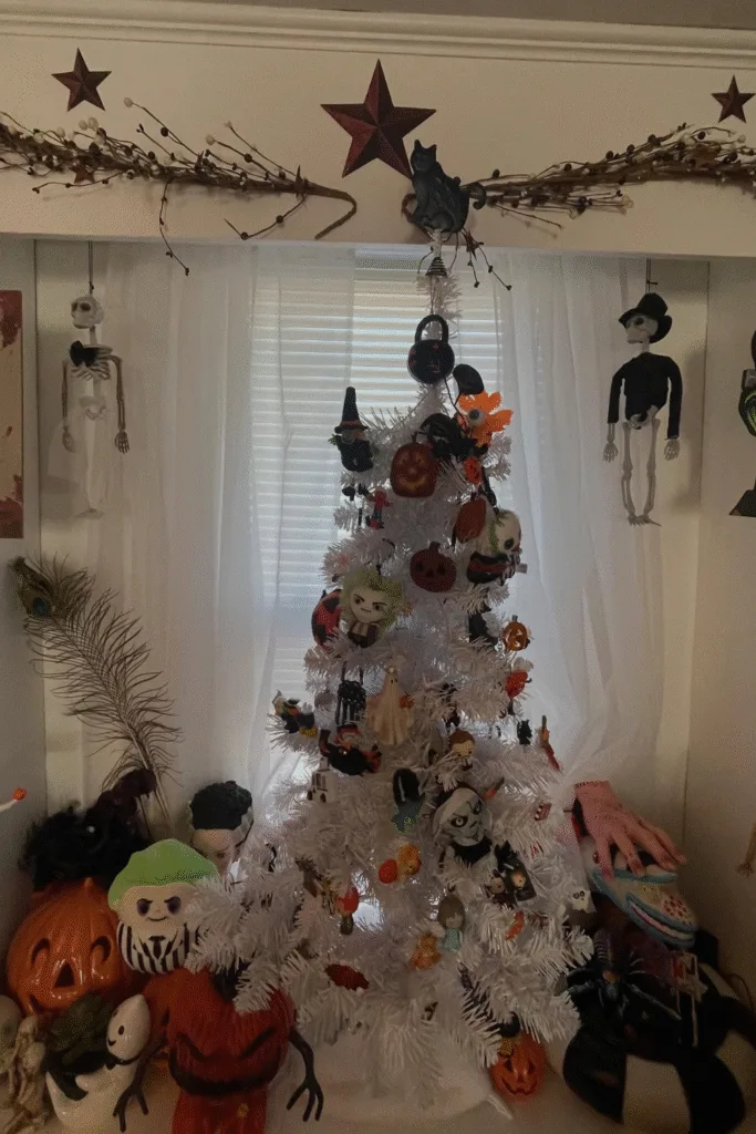 White Christmas tree Halloween decorations with hanging skeletons