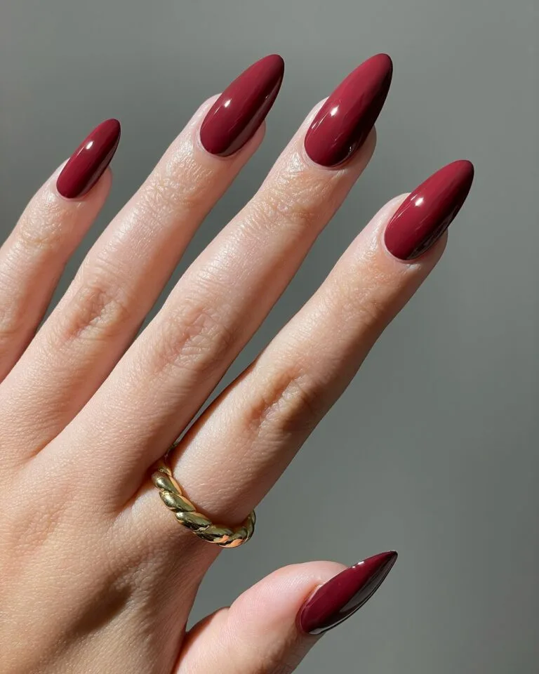 almond-shaped nails in glossy cherry mocha fall nail color