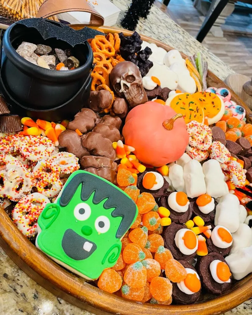 Halloween charcuterie board with black cauldron centerpiece