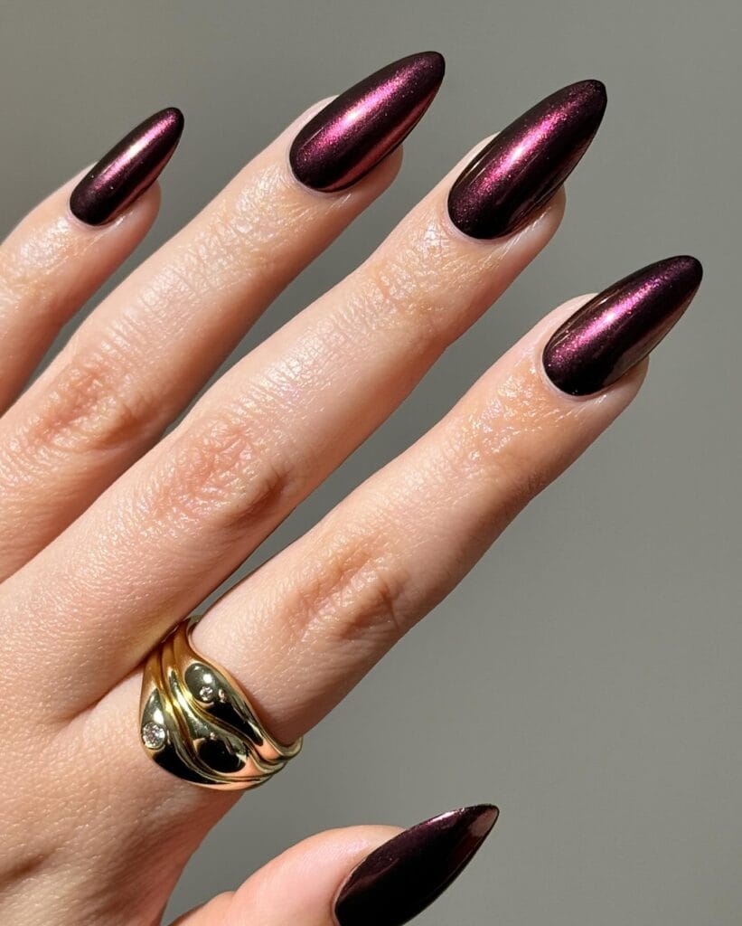 almond nails with dark plum metallic chrome polish, October nail design