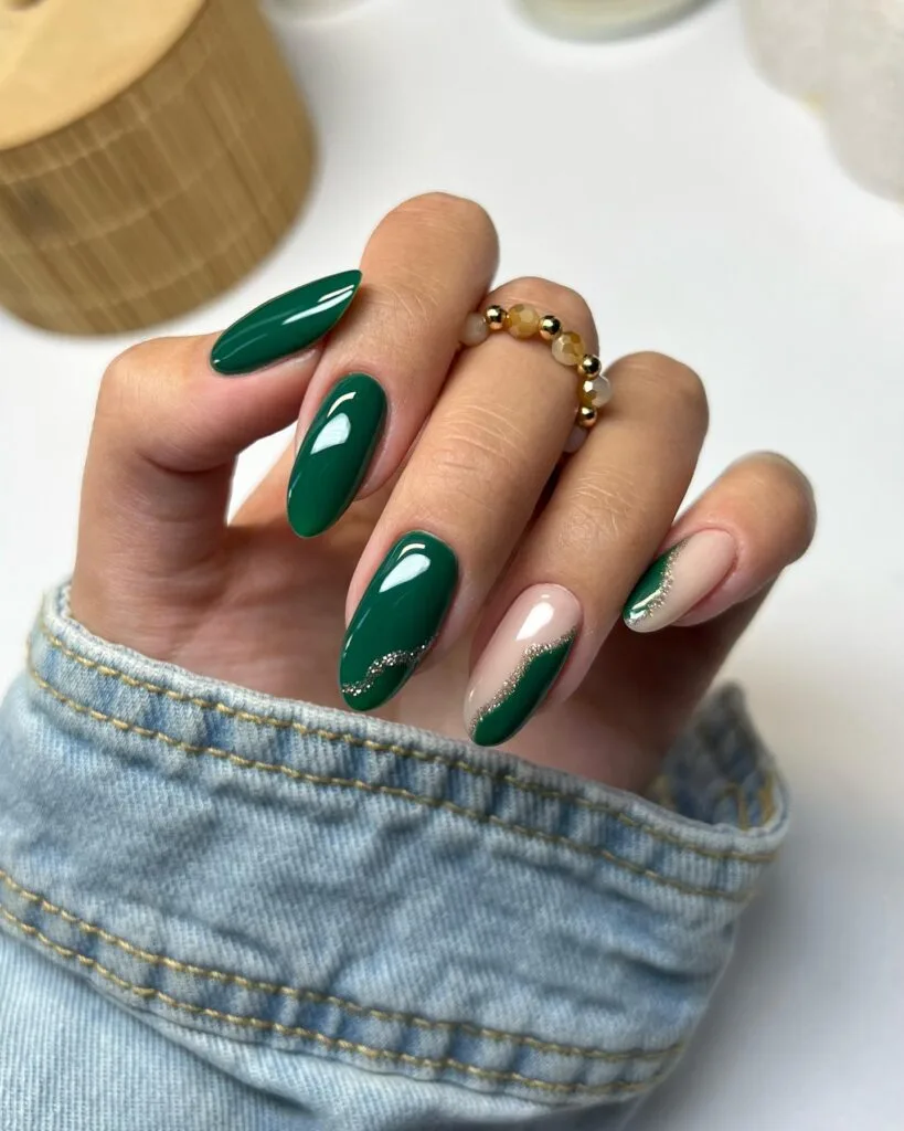 Dark green nails with nude accents and metallic silver squiggle design