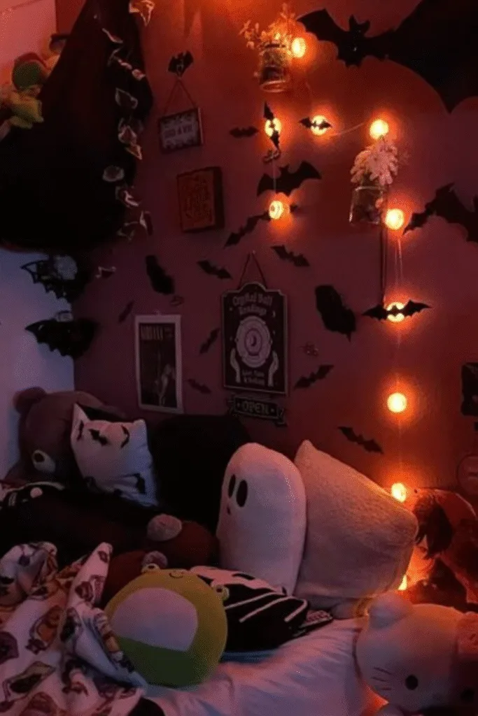 Halloween decorations bedroom with bats on wall and orange lights