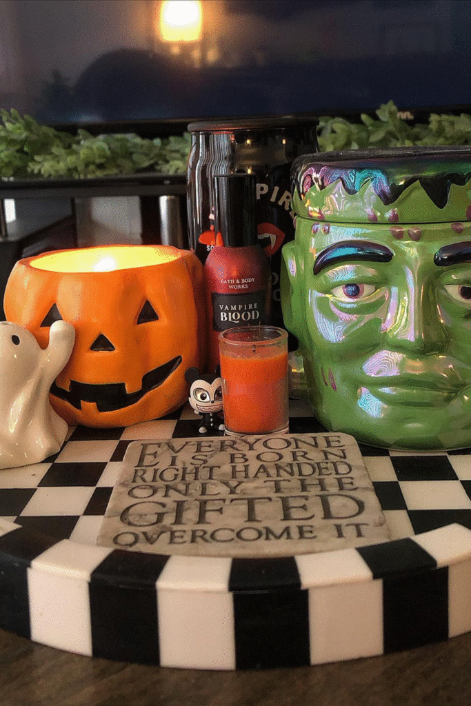 Halloween decor with Frankenstein mug and vampire blood bottle