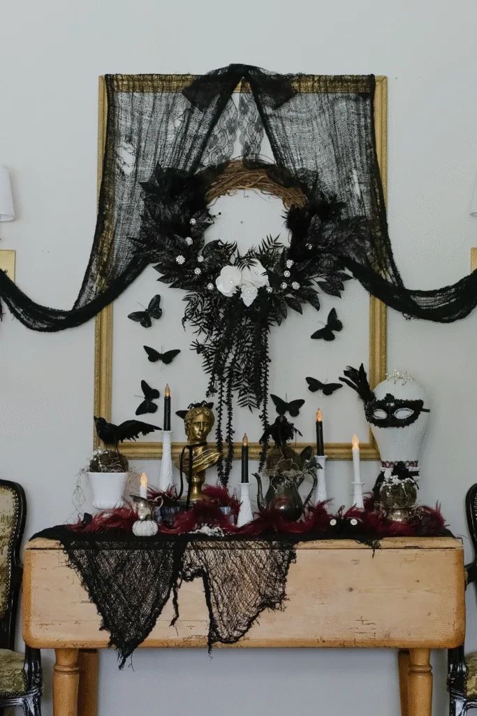 Halloween decor ideas with black butterflies, lace and gold frame
