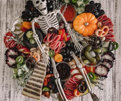 Halloween charcuterie board with skeleton centerpiece