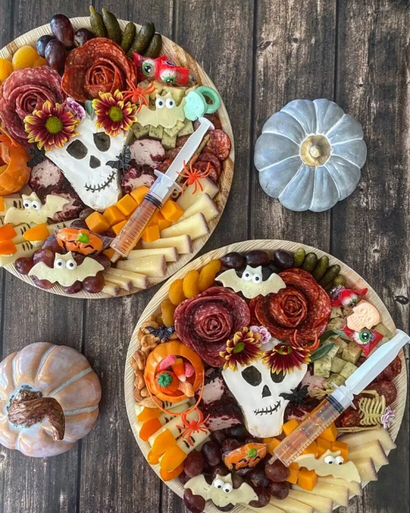 Halloween charcuterie board with skull, salami roses and cheese