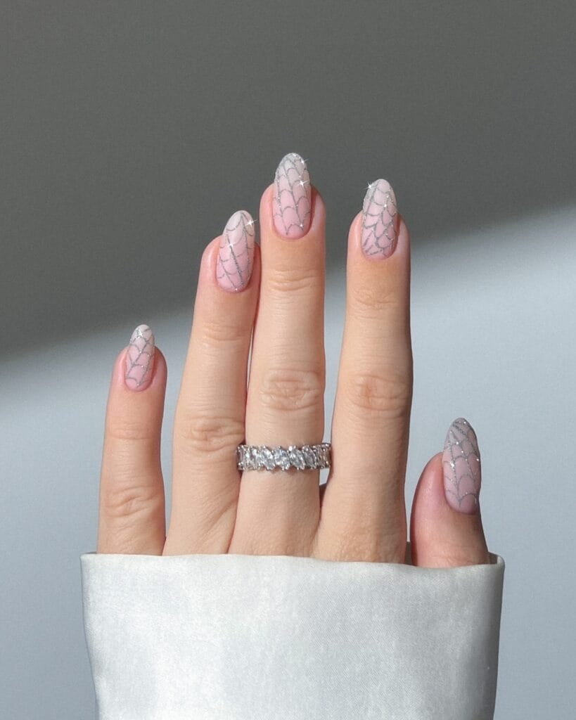 almond pink nails with silver spiderweb nail art, Halloween nail ideas