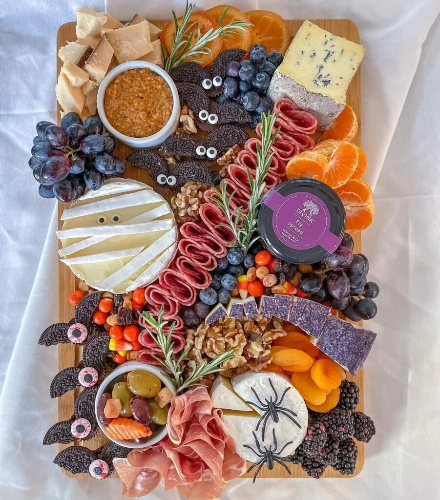 Halloween charcuterie board with Oreo bat cookies and mummy brie