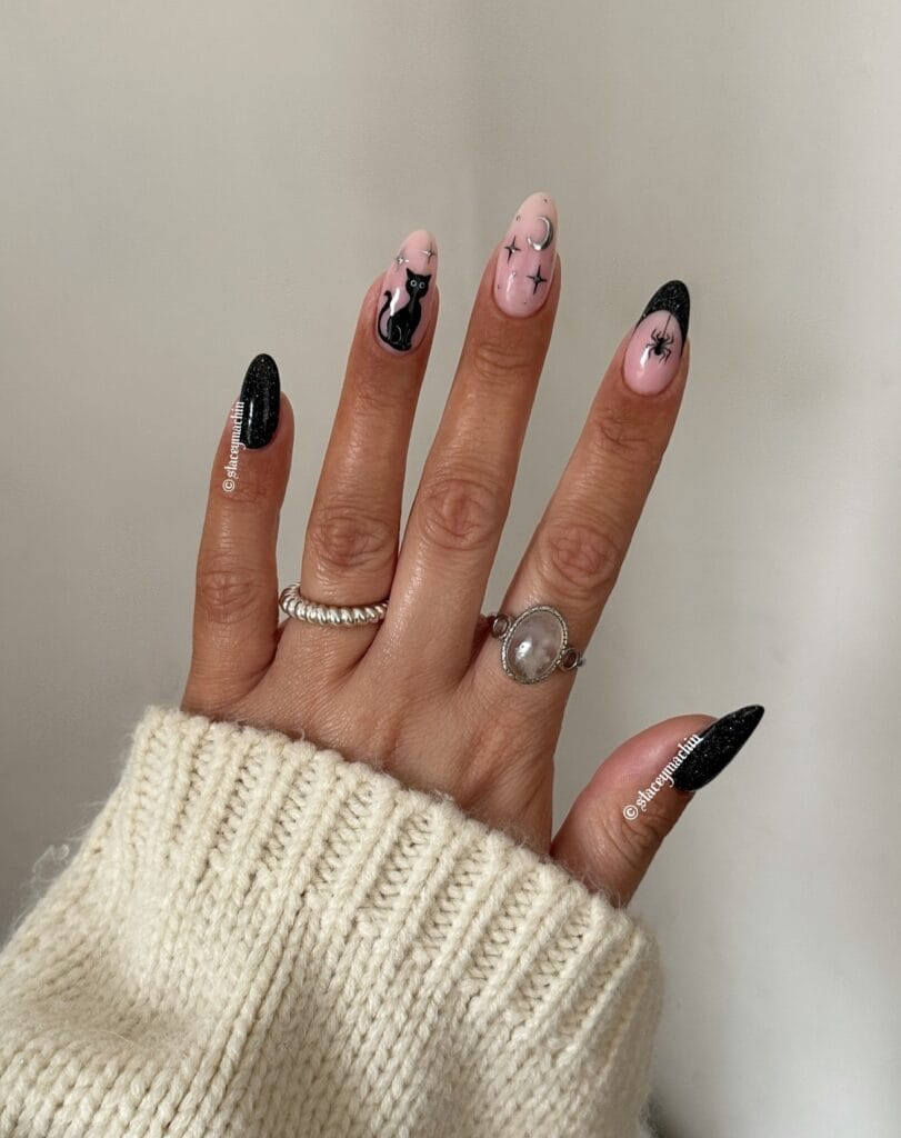 black glitter almond nails with black cat, silver moon and spider French tip on pale pink, Halloween nails