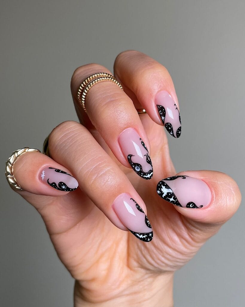 pink almond nails with black wavy French tips and tiny white bats and stars, spooky chic Halloween nails