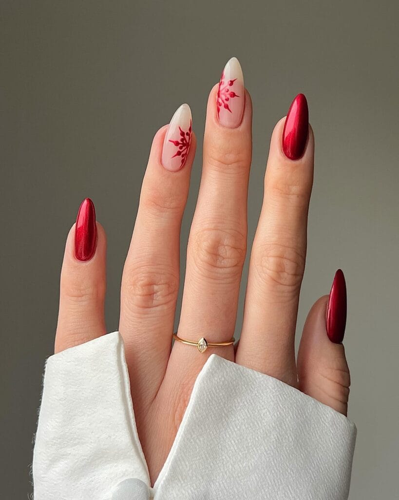 sheer nails with red snowflakes art and deep red chrome accent nails, Christmas nails