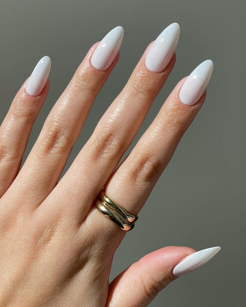 almond-shaped creamy white nails, minimalist winter old money manicure
