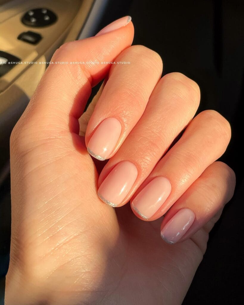 short pink nails with silver micro-French tips, December nail ideas
