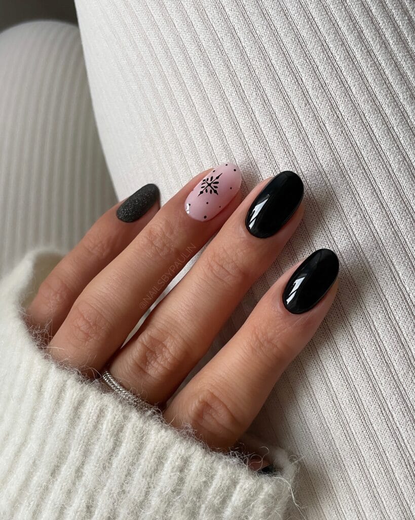 black and pale pink nails with matte snowflake accent, winter Christmas nail art