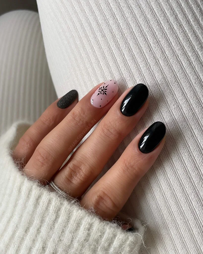 black and pale pink nails with matte snowflake accent, winter Christmas nail art