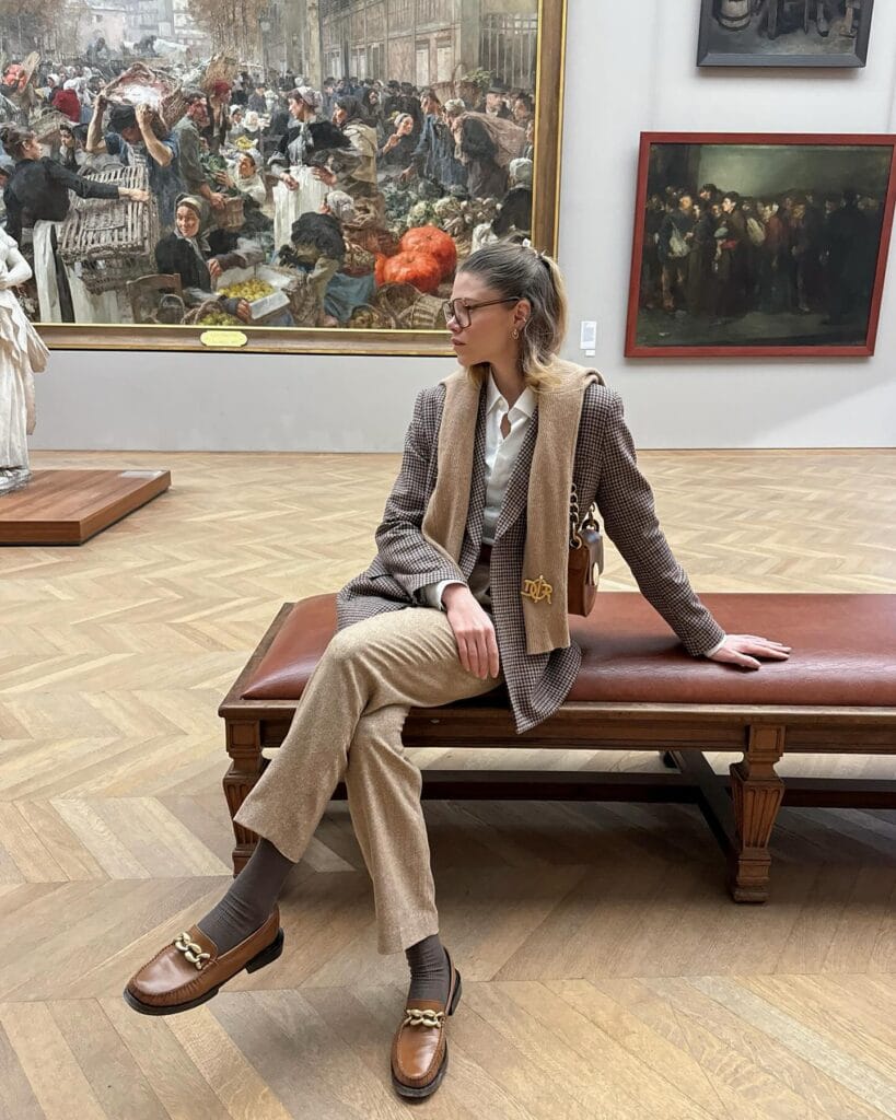 checked blazer and tan trousers with loafers and camel scarf, winter paris winter outfit
